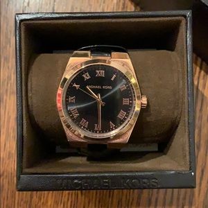 Michael Kors men’s timepiece.  Rose gold